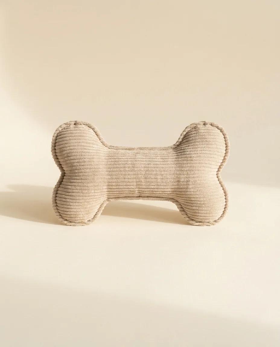 An oatmeal corduroy plush bone