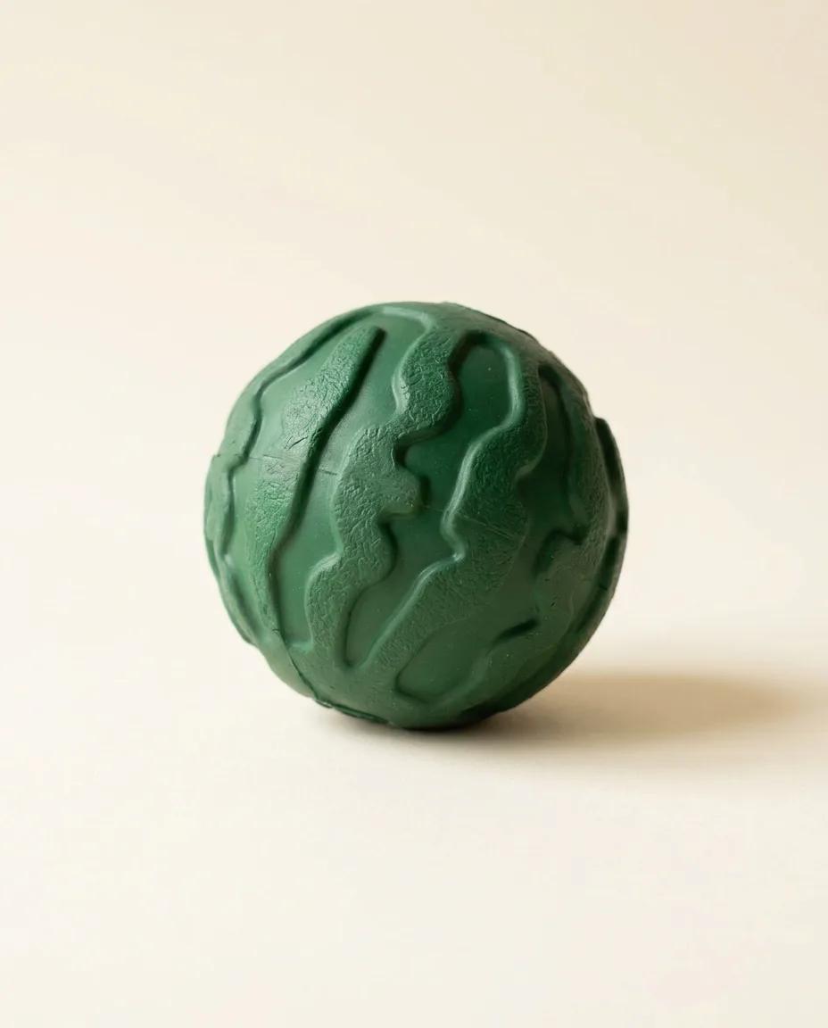 A green rubber chew ball